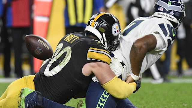 Pittsburgh Steelers LB T.J. Watt tackles Seattle Seahawks QB Geno Smith